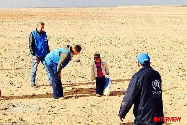 A file photo of four-year-old Syrian refugee Marwan being assisted by UNHCR officials / photo credit: dailymail.co.uk