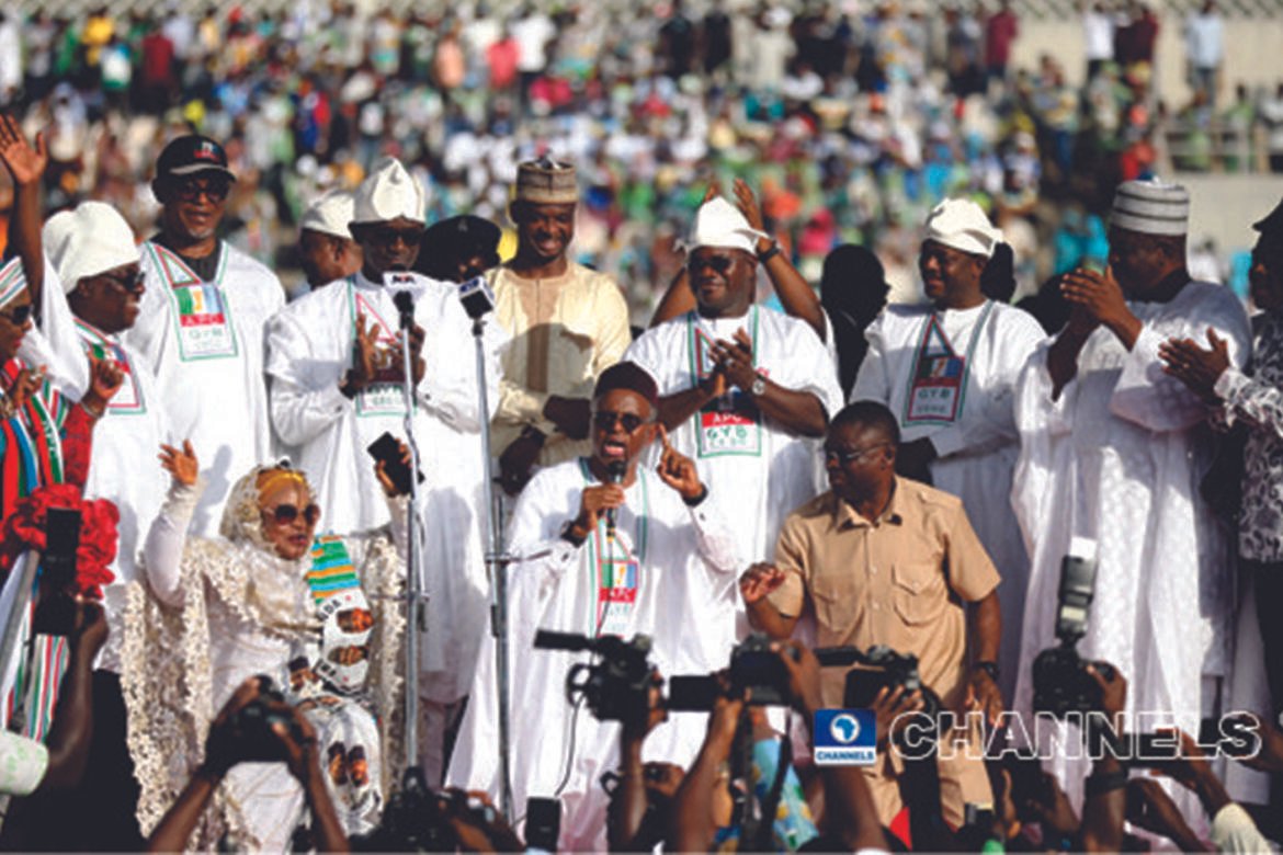 Governor Nasir el-Rufai of Kaduna State kneeling to beg Kogi Voters to forgive Governor Yahaya Bello in Lokoja, yesterday / Photo credit:Channels Tv