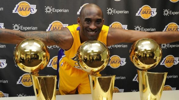 Kobe Bryant pictured with his five NBA titles / Photo credit: news.sky.com