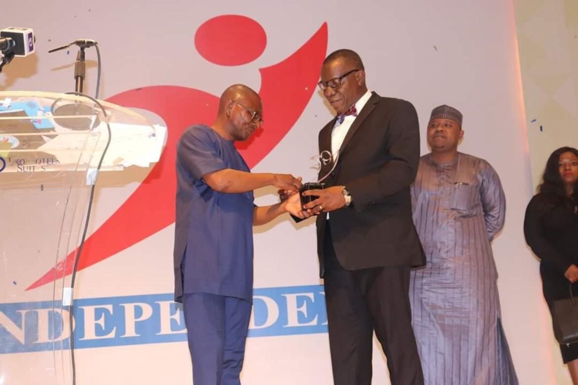 Director, Public Affairs, Nigerian Communications Commission (NCC), Dr. Henry Nkemadu (right) receiving the award at the event / Photo credit: NCC