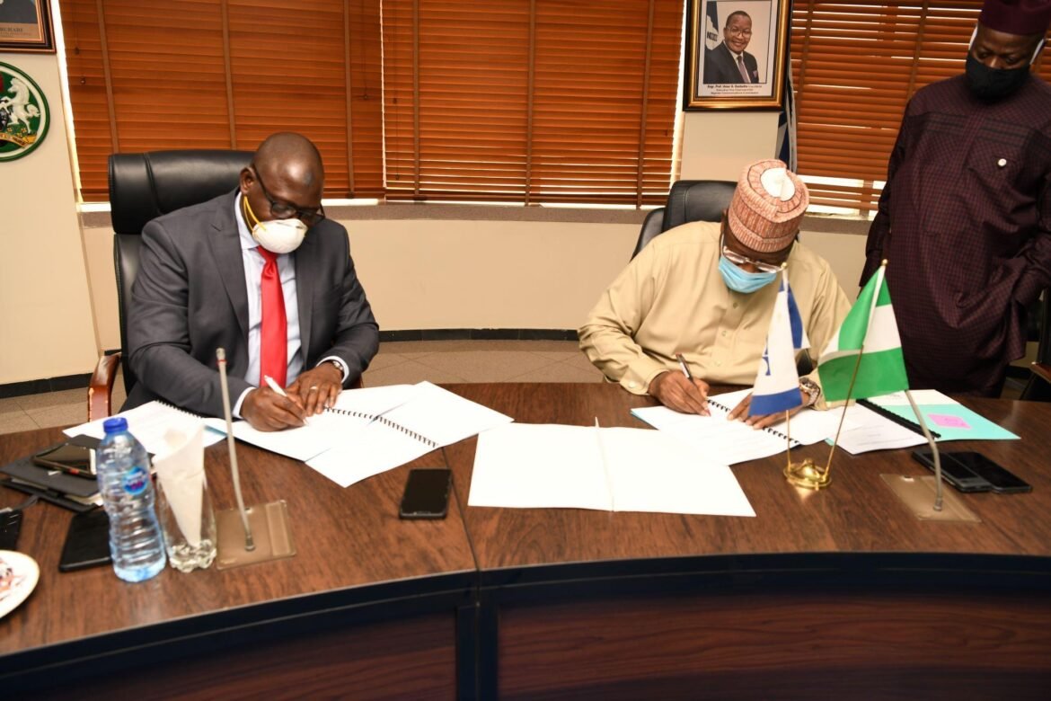 L-R: Muhammad Nami, Executive Chairman, Federal Inland Revenue Service (FIRS); Prof. Umar Danbatta, Executive Vice Chairman, Nigerian Communications Commission (NCC) signing the Memorandum of Understating (MoU) to ascertain Value-Added Tax (VAT) elements in telco’s transactions in Abuja on Tuesday / Photo credit: NCC
