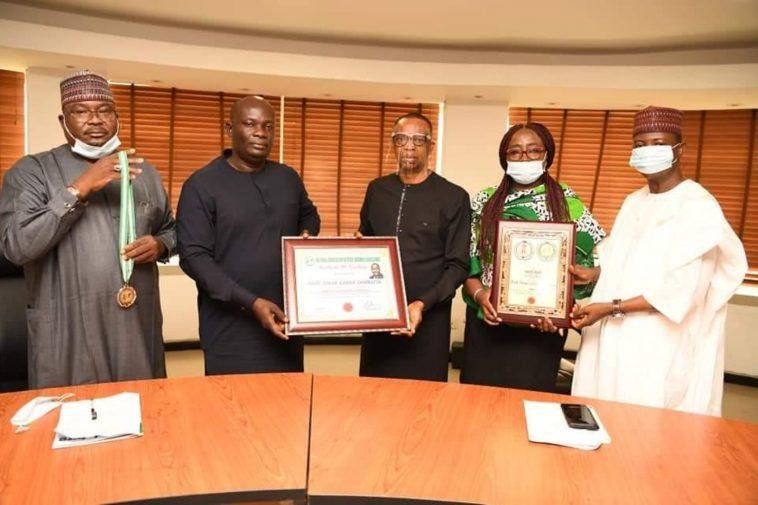 L- R: Bashir Bello, Head, Legislative and Government Relations, Nigerian Communications Commission (NCC); Hon. Uchechukwu Chukwuma, Director General, National Association of State Assembly Legislators (NASAL); Dr. Ikechukwu Adinde, Director, Public Affairs, NCC; Truddy Tony-Awusaku, Principal Manager, Public Affairs, NCC; Hon. Usman Ali, Co-ordinator, North-West Zone, NASAL, during the presentation of National Award of Excellence to Prof. Umar Garba Danbatta, Executive Vice Chairman/CEO, NCC by NASAL at the Commission's Headquarters Abuja. Adidnde received the award on behalf of the EVC / Photo credit: NCC