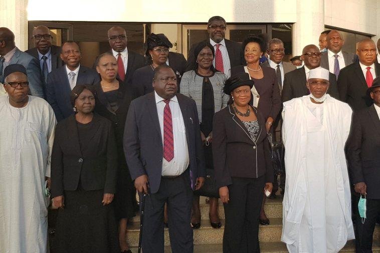 Standing front row (4th from right), Hon. Justice Monica Dongban-Mensem; MD/CEO AMCON, Mr Ahmed Kuru (3rd from right) and other Justices, staff of National Judicial Institute (NJI) and AMCON among other participants in a group photograph at the end of the opening day of the seminar / Photo credit: AMCON