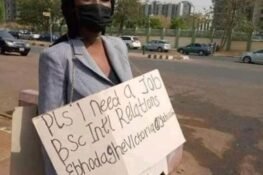 Nigerians React As Unemployed Graduate Markets Self With Placard On Abuja Road