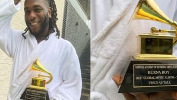 Burna Boy with his Grammy Award plaque / Photo credit: Rosbena