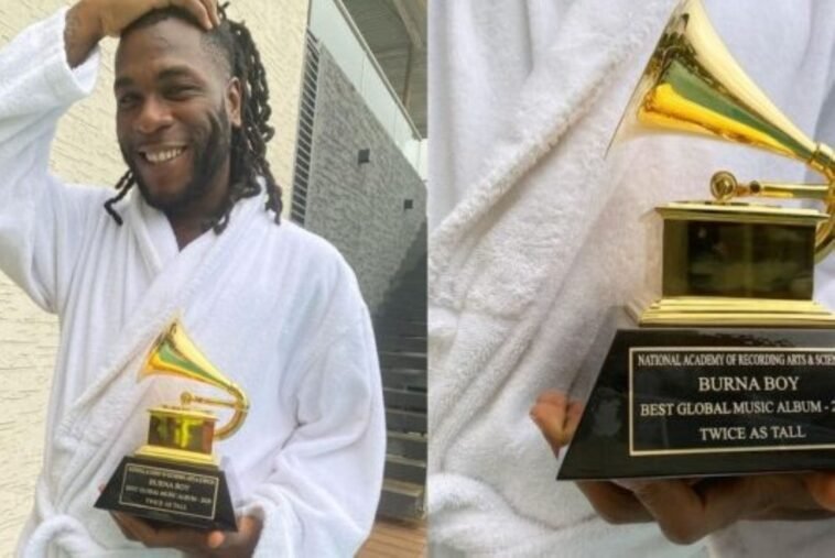 Burna Boy with his Grammy Award plaque / Photo credit: Rosbena